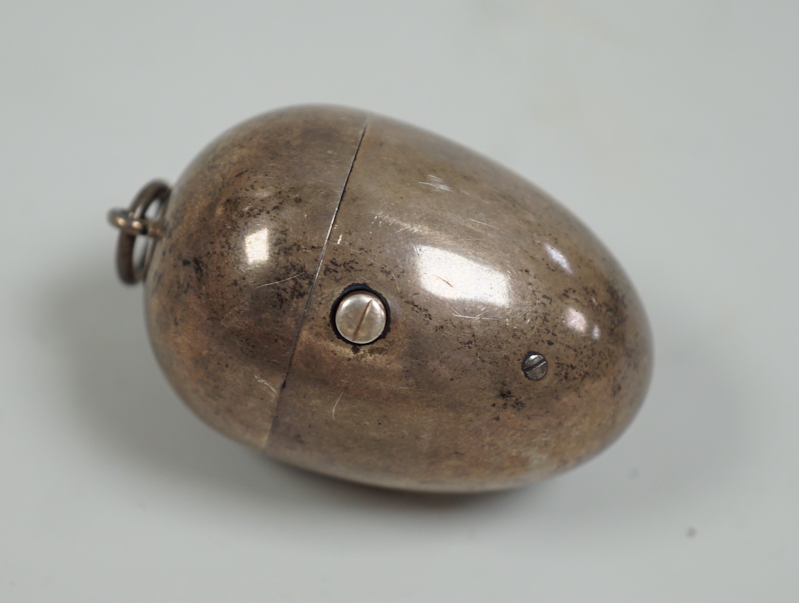 A Victorian silver egg shaped etui, with associated interior spool?, Thomas Johnson II, London, 1878, 49mm.